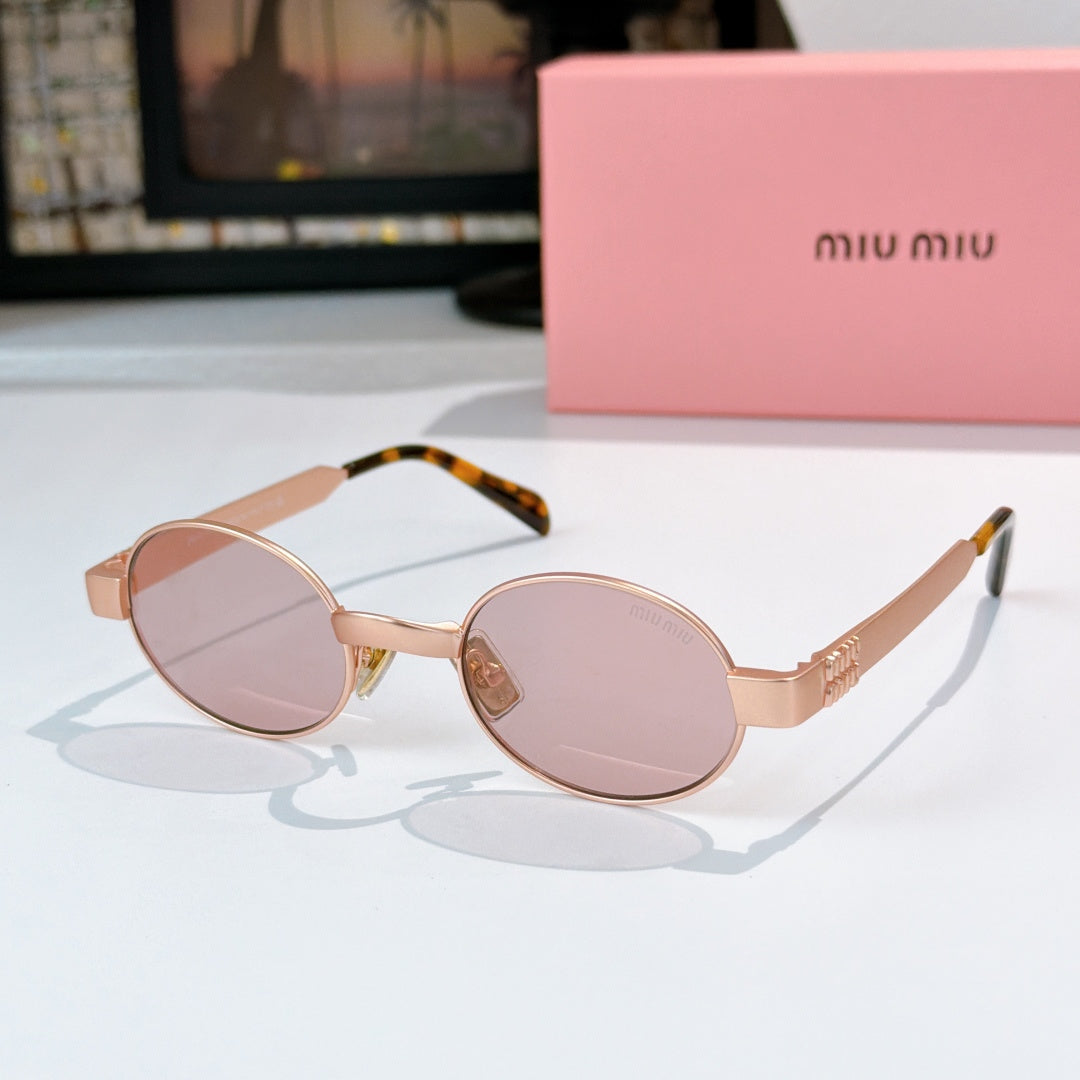 MiuMiu sunglasses with gold-tone round frames, blush-pink lenses, tortoise-pattern temples