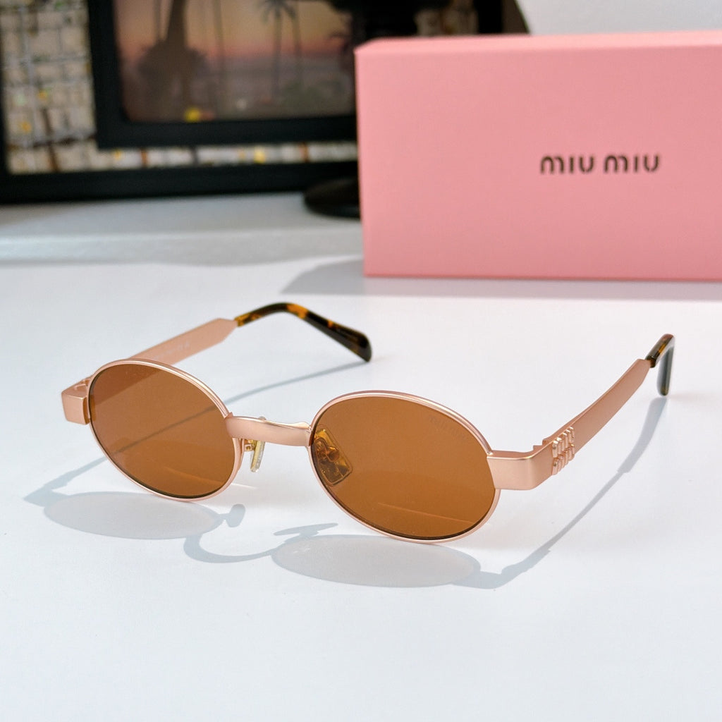 MiuMiu sunglasses with gold-tone round frames, amber-brown lenses, tortoise-pattern temples