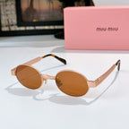 MiuMiu sunglasses with gold-tone round frames, amber-brown lenses, tortoise-pattern temples