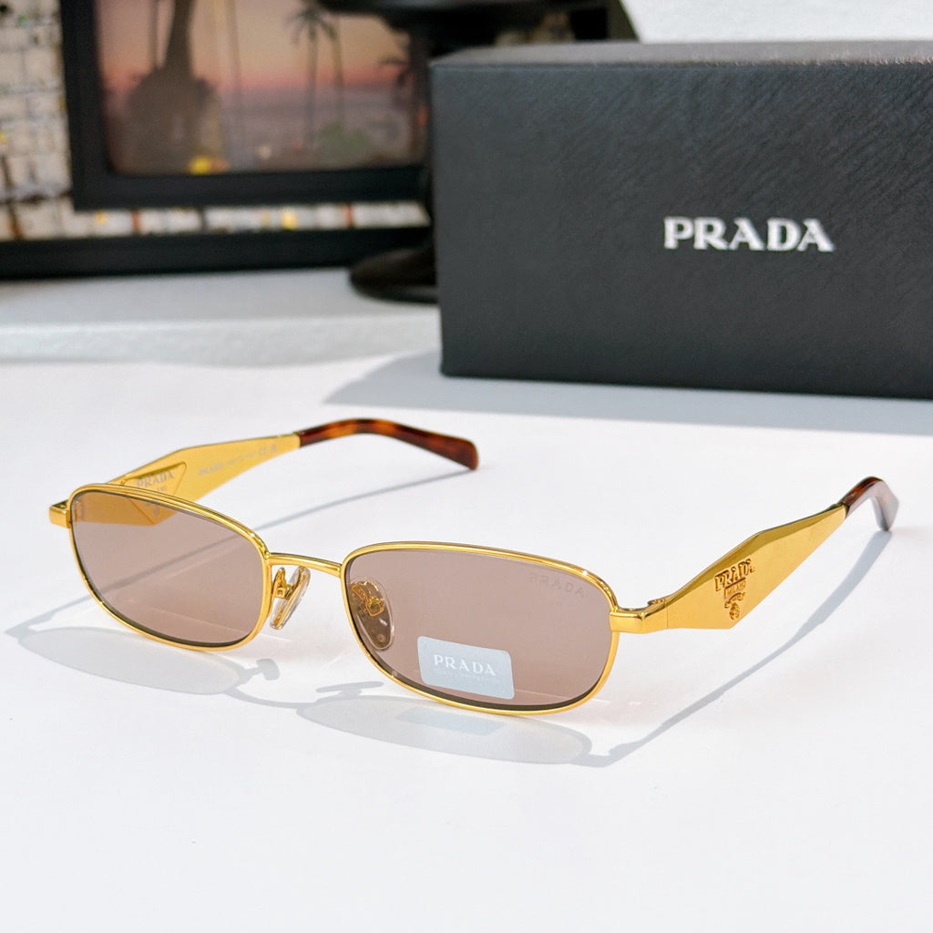 Prada sunglasses, gold frame with warm yellow lenses, amber tortoiseshell temples