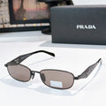 Prada sunglasses, black frame with brown lenses