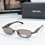 Prada sunglasses, black frame with brown lenses