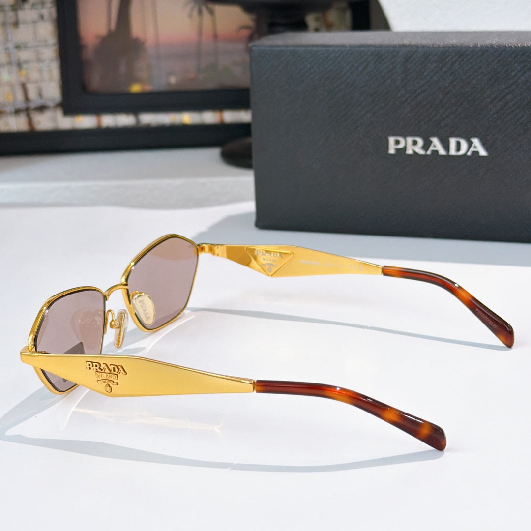 Prada glasses with gold frames, pink lenses, tortoiseshell arms