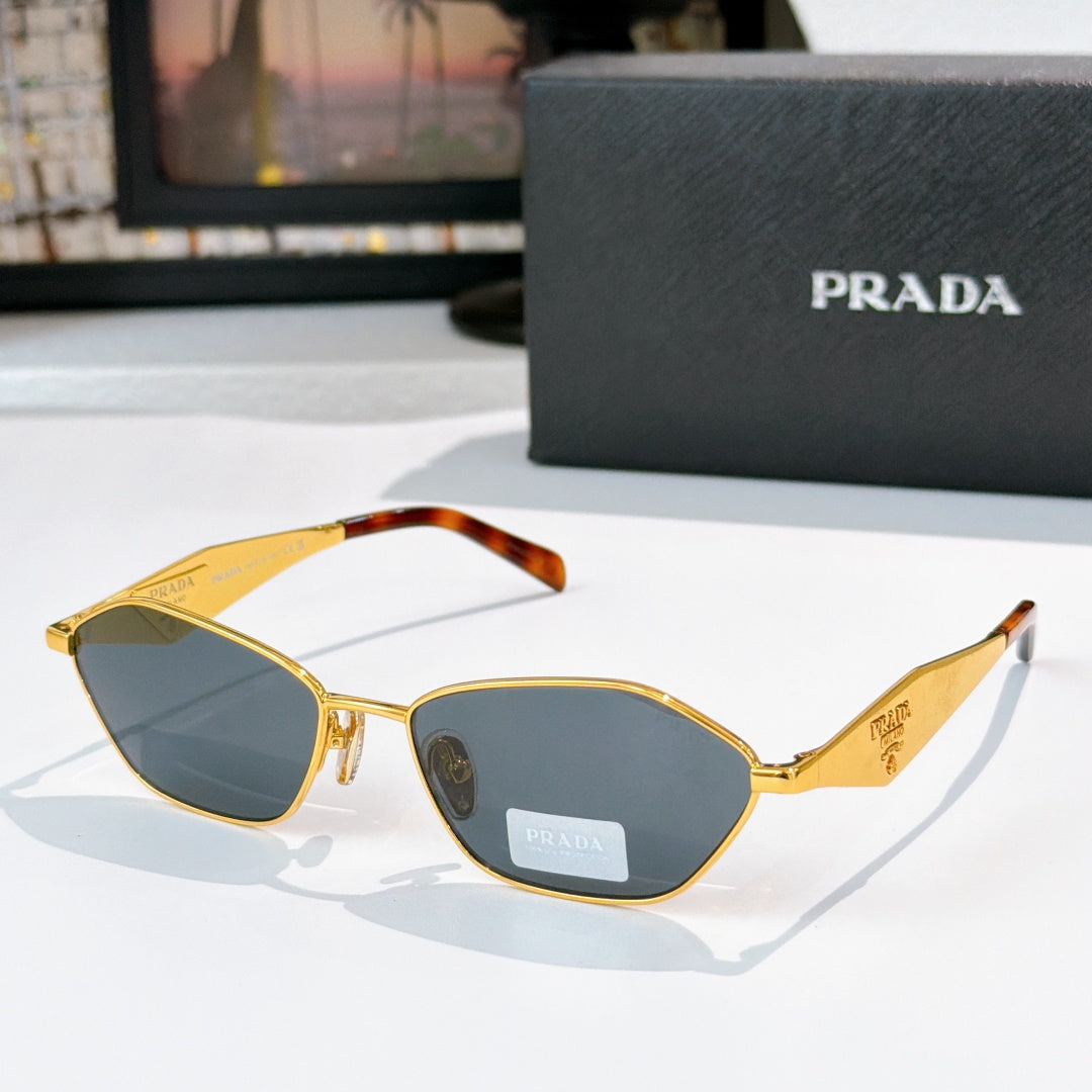 Prada glasses with gold frames, blue lenses, tortoiseshell arms