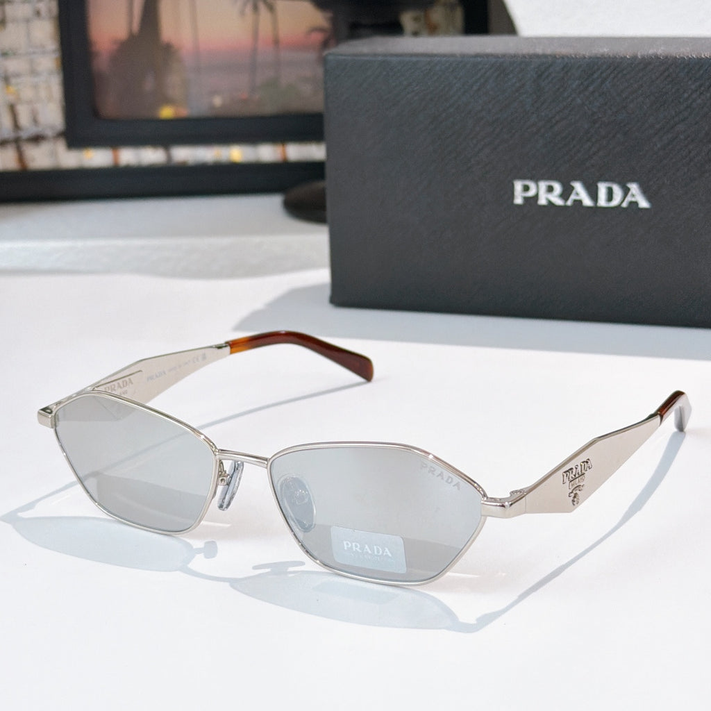Prada glasses with silver frames, tortoiseshell arms, light blue lenses