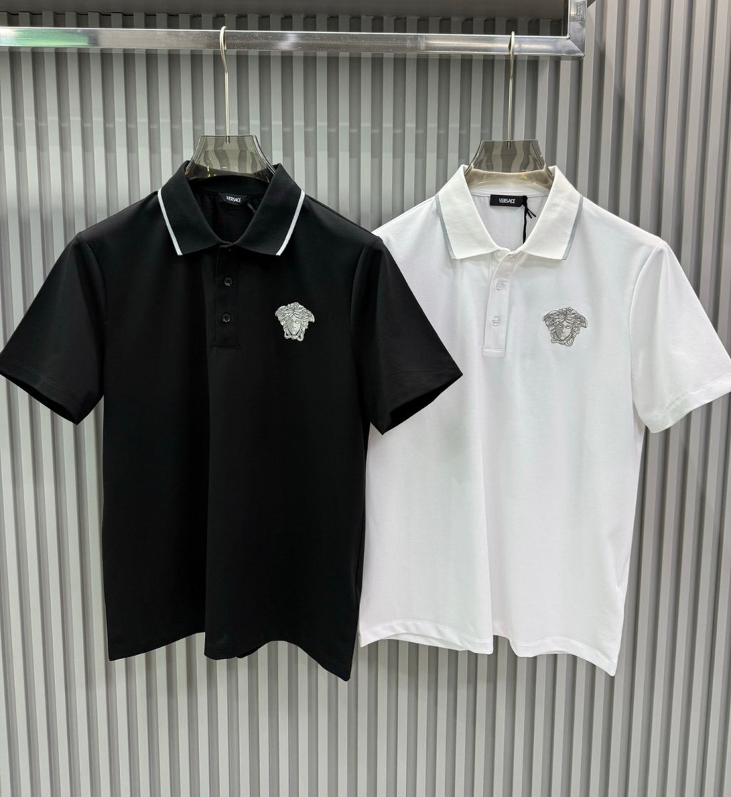 Two Versace polo shirts: black and white, each with white-trim collar and Medusa crest