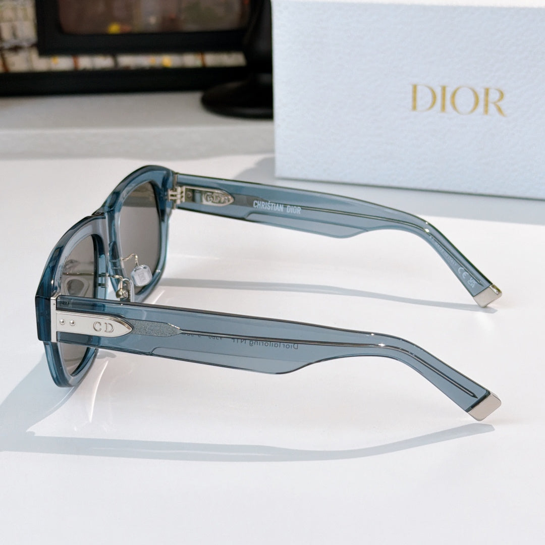 Dior sunglasses side view with blue frames and clear arms with logo details.