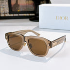 Dior sunglasses with brown frames and warm brown lenses.