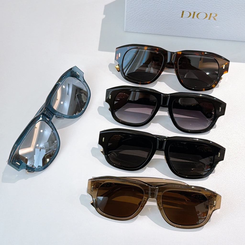 Dior sunglasses assortment with blue, black, and brown frames and tinted lenses.