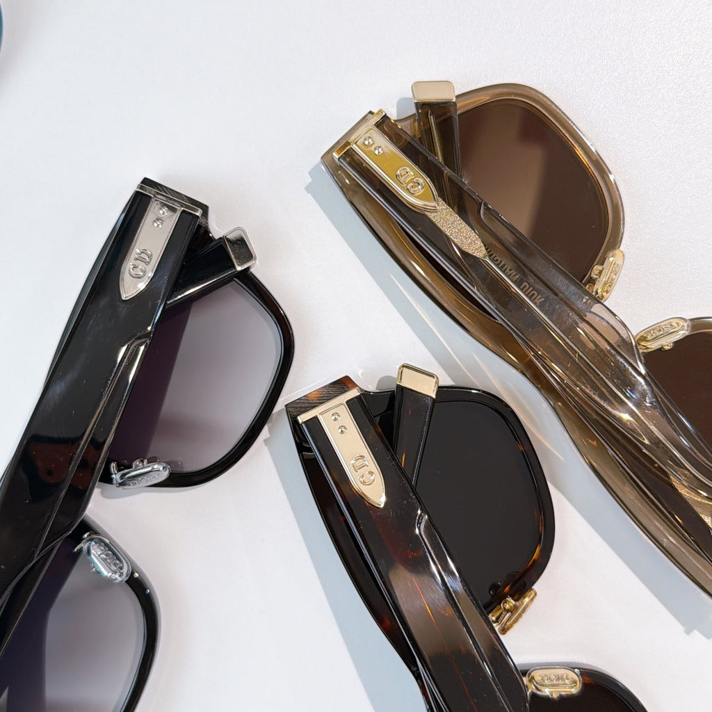 Dior sunglasses assortment, black and gold-tone frames with tinted lenses