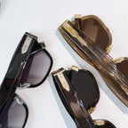 Dior sunglasses assortment, black and gold-tone frames with tinted lenses