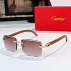 Square sunglasses with wood-look brown arms and mauve tinted lenses, gold embellished bridge