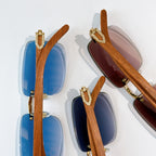 Pair of square sunglasses with wood-look brown arms; one blue, one dark brown tinted lens
