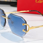Close-up of gold octagonal sunglasses with blue lenses and dark tortoise temples