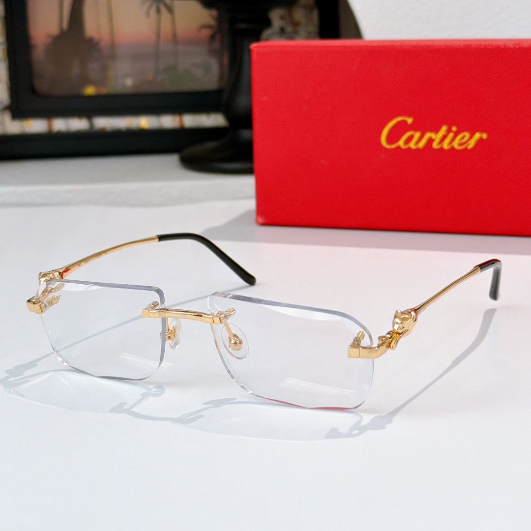 Cartier glasses with gold frames and clear lenses, black temples and ornate bridge