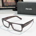 Prada eyeglasses with dark brown rectangular frame and clear lenses
