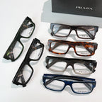 Prada eyeglasses assortment in black, tortoiseshell, brown, blue, and green rectangular frames