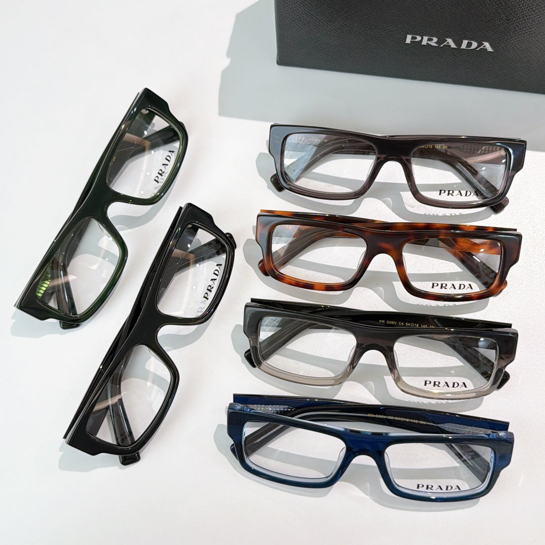 Prada eyeglasses assortment in black, tortoiseshell, brown, blue, and green rectangular frames