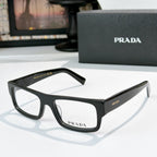 Prada eyeglasses with glossy black rectangular frame and clear lenses