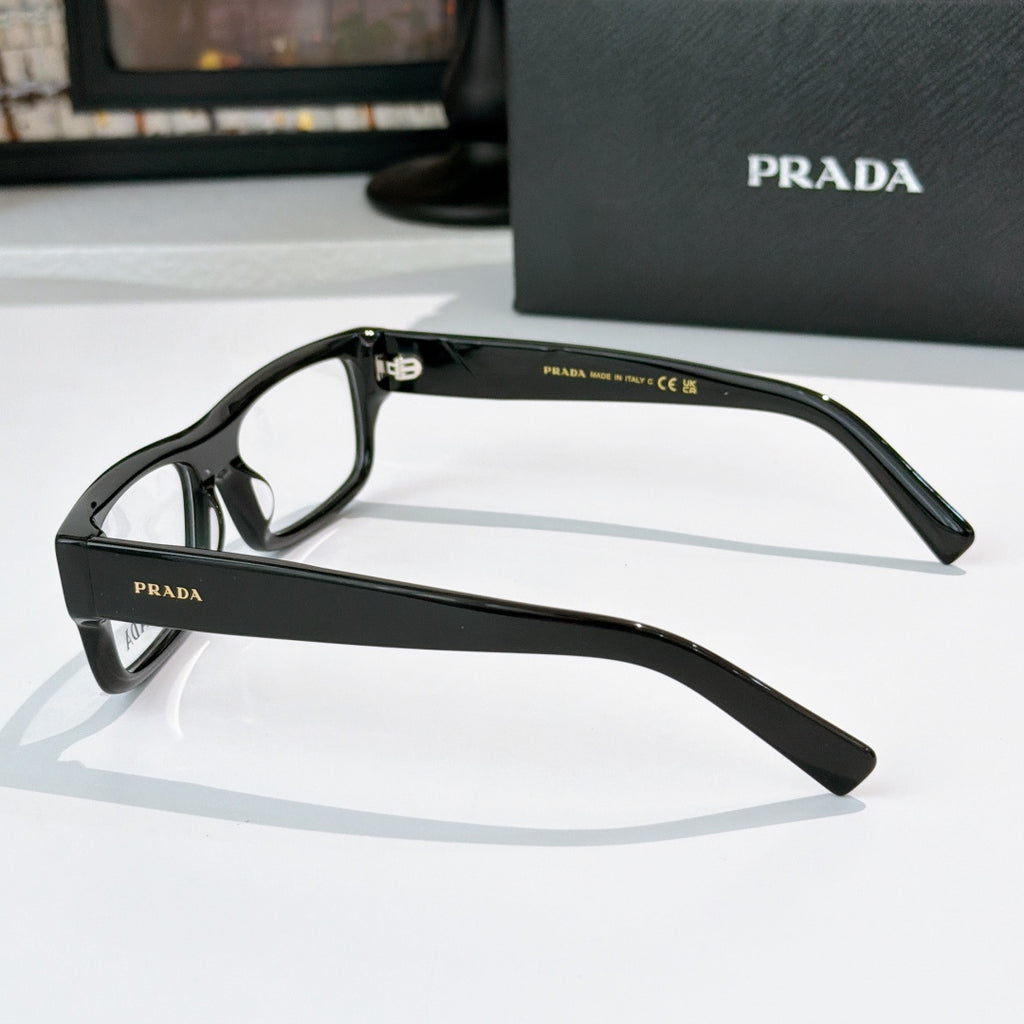 Prada eyeglasses side view with matte black rectangular frame and clear lenses