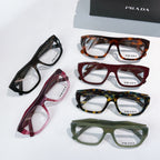 Prada eyeglasses set of five frames in black, red, tortoiseshell, and green