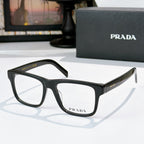 Prada black eyeglasses with rectangular frames and clear lenses.