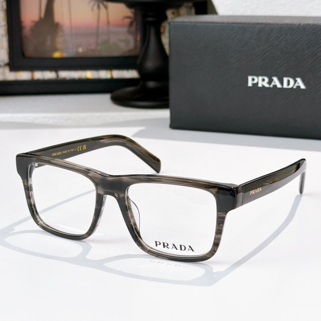 Prada dark tortoiseshell eyeglasses with rectangular frames and clear lenses.