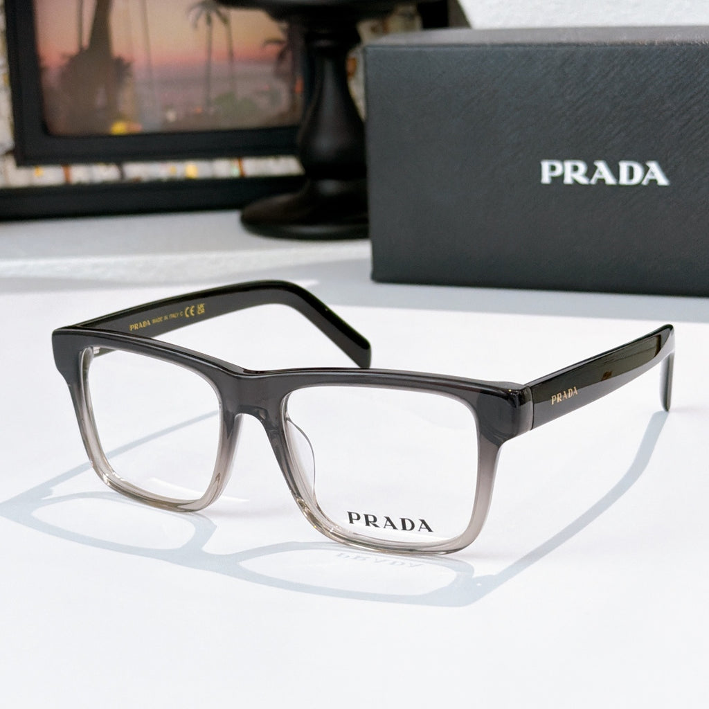 Prada dark acetate eyeglasses with rectangular frames and clear lenses.