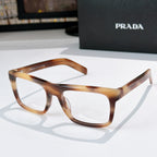 Tortoiseshell square eyeglasses with clear lenses and angular temple tips