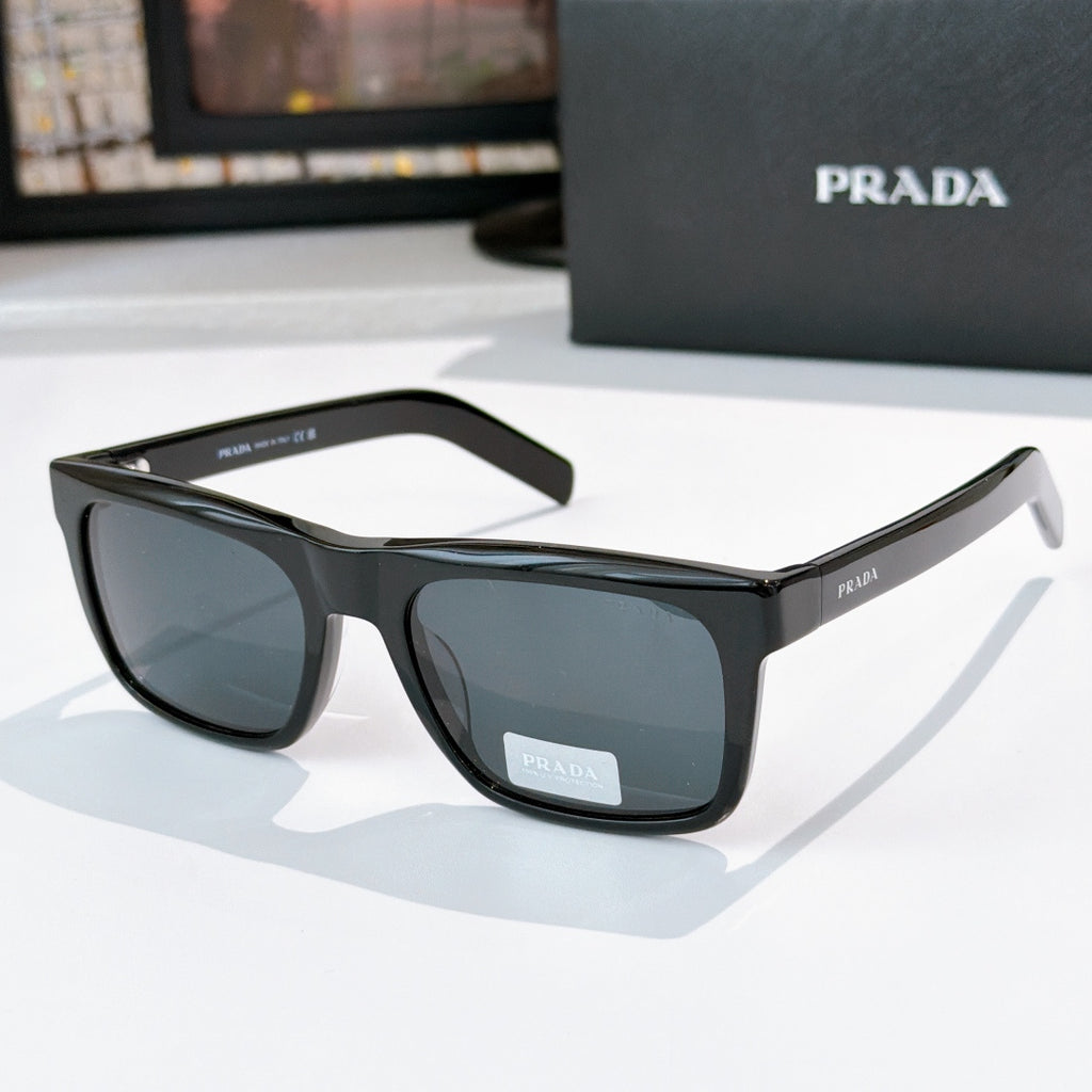 Black square eyeglasses with blue tinted lenses and thick full-rim frame