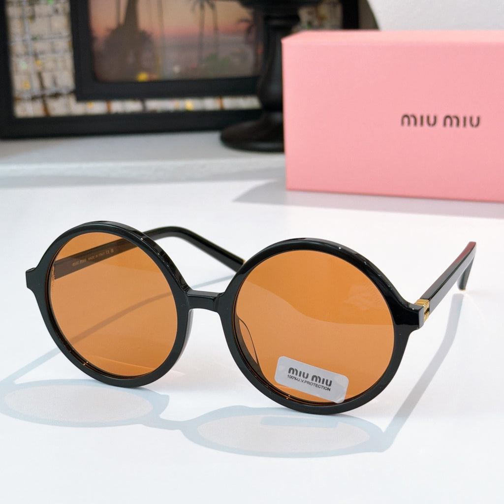 MiuMiu glasses with black round frames and orange-tinted lenses