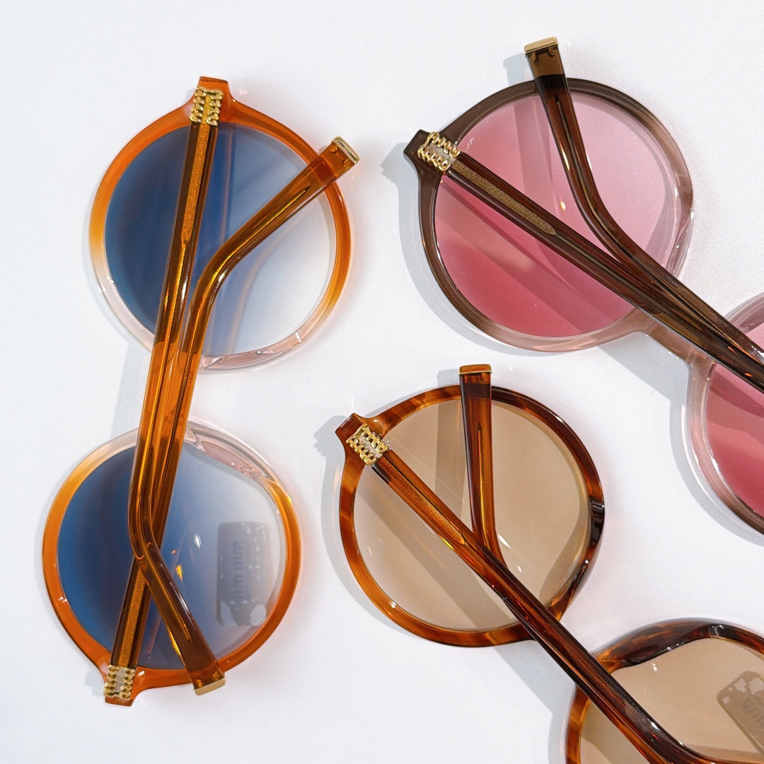 MiuMiu round eyeglass frames in amber, blue, and pink lens tints (set view)