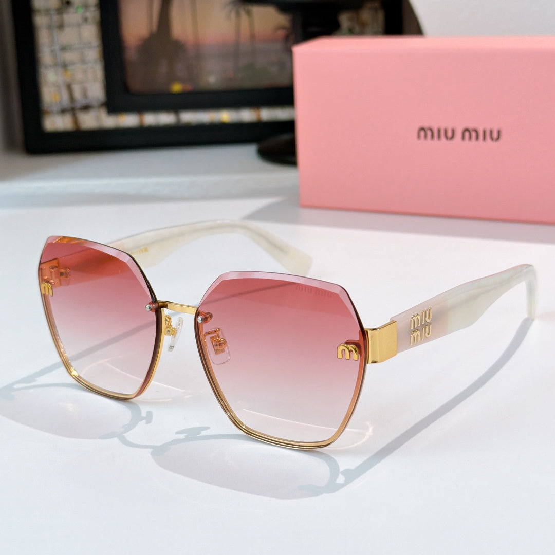MiuMiu octagonal sunglasses with pink gradient lenses and gold-tone frame
