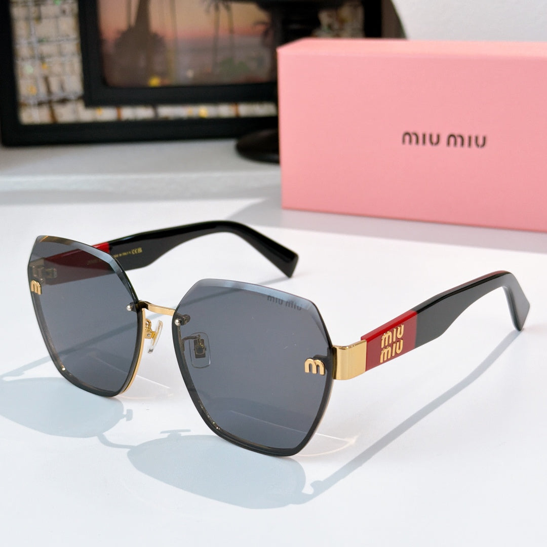 MiuMiu octagonal sunglasses with black frame and blue-gray gradient lenses