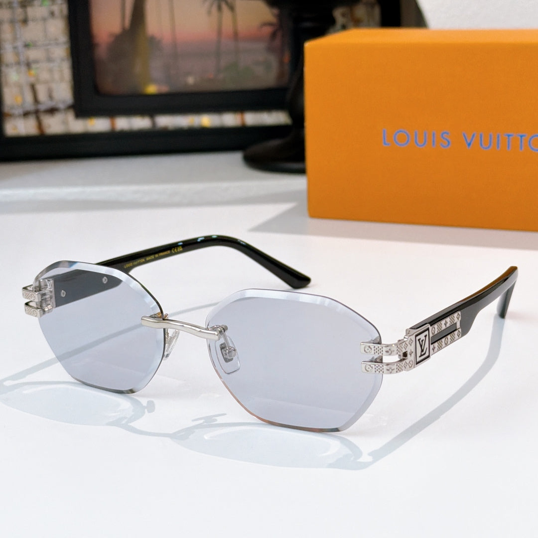 Sunglasses with light blue lenses and gold-tone frame, round silhouette