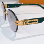 Sunglasses side view with green temples and gold-tone logo bar detail