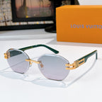 Sunglasses with cool-toned lenses, gold-tone frame and green temple tips