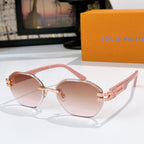 Sunglasses with pink-tinted lenses and gold-tone frame, round silhouette