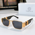 Versace sunglasses with gold metal frame and dark blue tinted square lenses