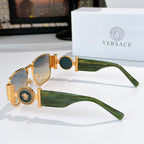 Versace sunglasses with gold frame, green temples, and dark blue tinted lenses