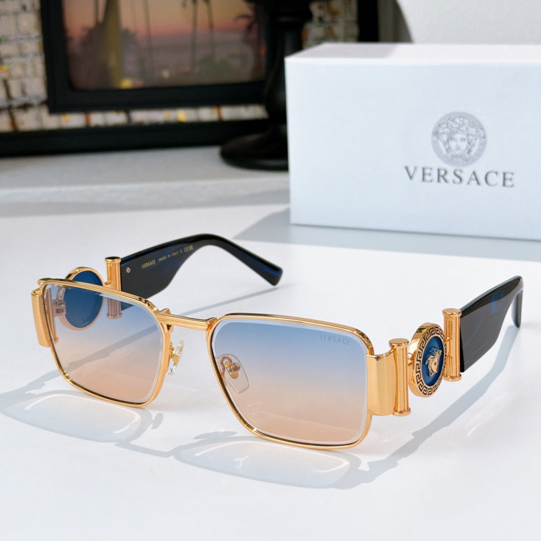 Versace sunglasses with gold metal frame and amber tinted square lenses