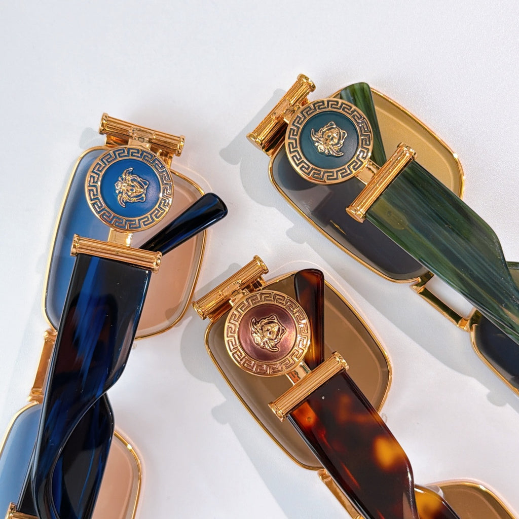 Versace sunglasses assortment with gold frames and blue and tortoise tinted lenses