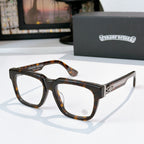 Dark tortoise square eyeglasses with clear lenses and jeweled logo on temple