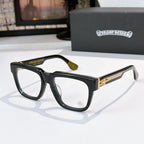 Black square eyeglasses with green-tinted temple tips and gold-toned temple detail