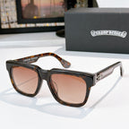 Amber-tinted sunglasses with tortoise frames and gold-engraved side lettering