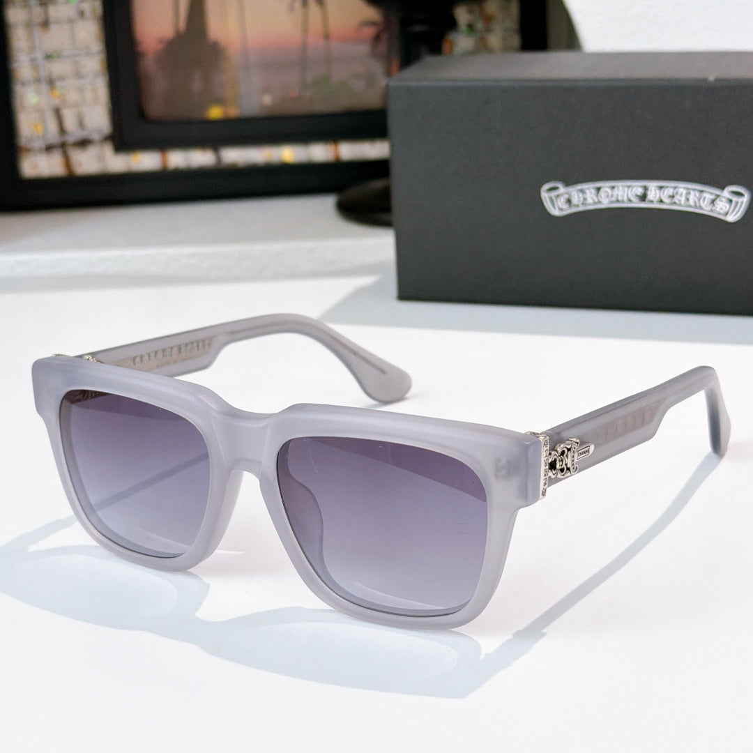 Purple-tinted sunglasses with light gray frames and engraved side logo detail