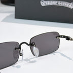 Sunglasses front close-up with dark lenses and black hinge detail