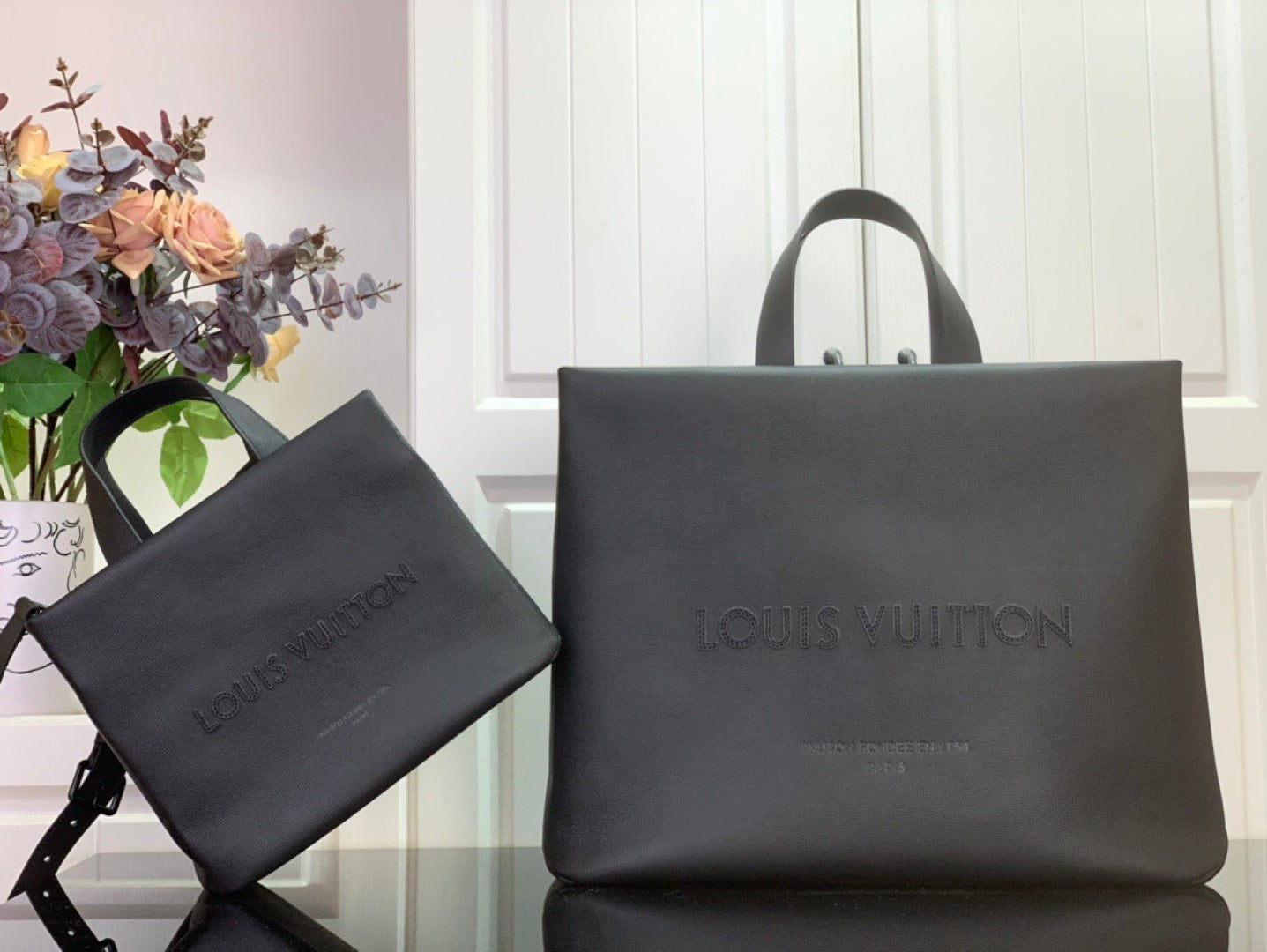 Louis Vuitton shopping bag set in dark gray with matching small pouch and top handles