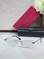 Gold-rim sunglasses with clear lenses and black temple tips