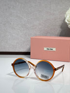 MiuMiu sunglasses with tortoiseshell round frames and blue tinted lenses, logo on lens